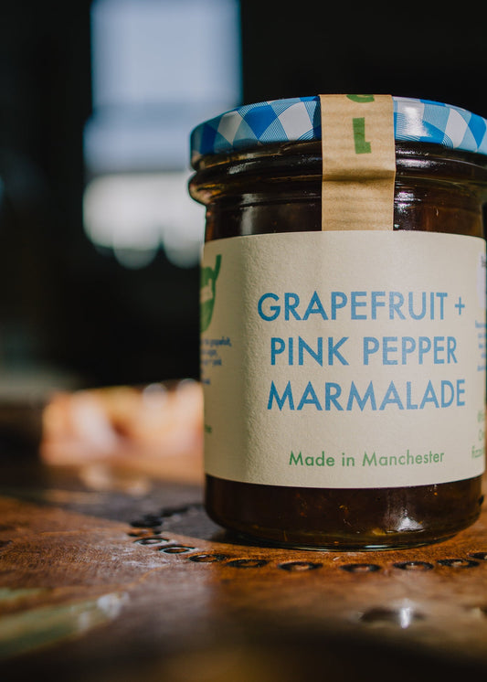 Jar of grapefruit and pink pepper marmalade, perfct Christmas festive gift for foodie and food loving friends.