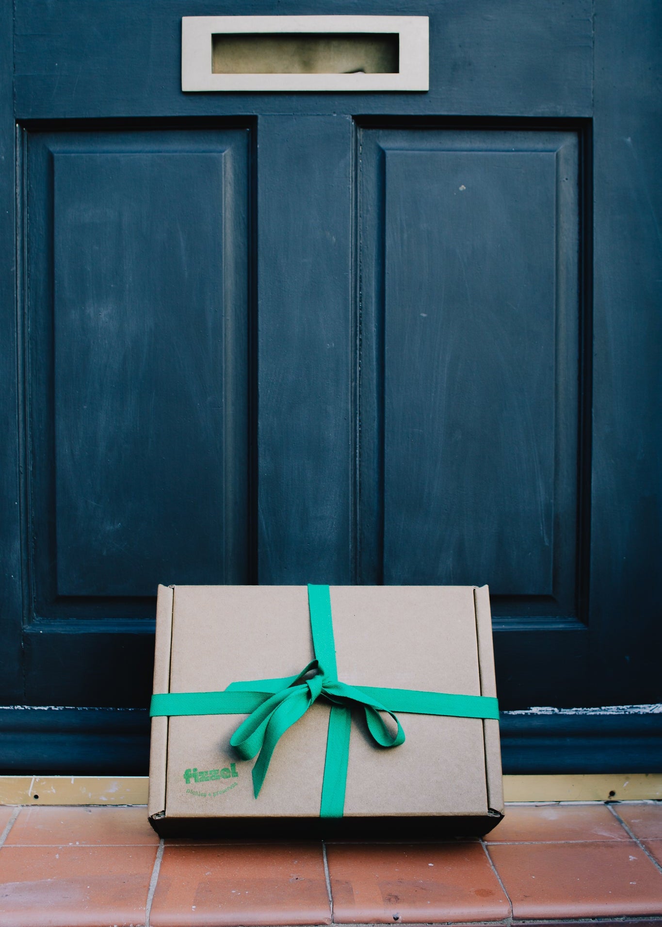 Gift box with a green ribbon. Gift ideas for foodies. 