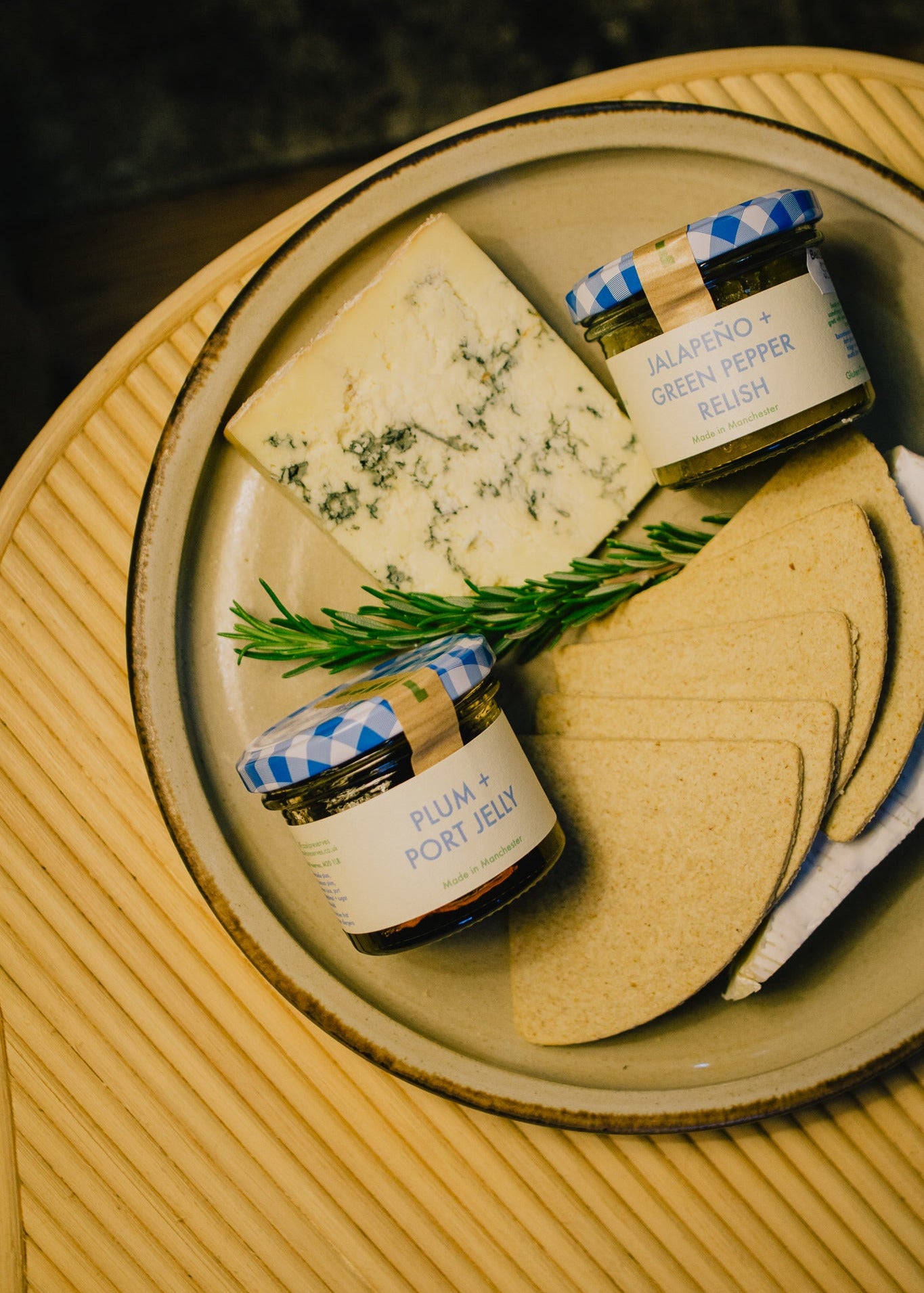 Festive cheeseboard Box containing Oatcakes, jelly, and jalapeño green pepper relish. Perfect gift for cheese lovers. 